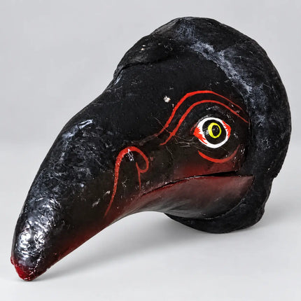 Profile view of Black Jatayu Mask showing curved beak