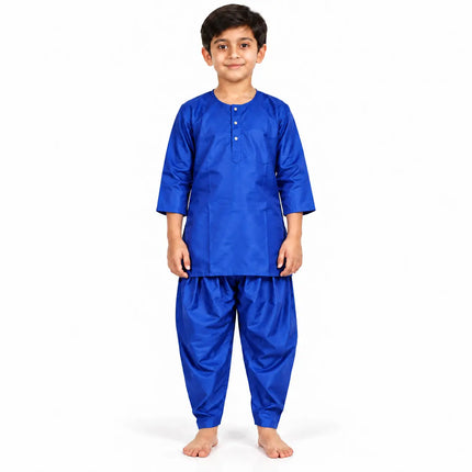 Boy wearing royal blue kurta and matching dhoti-style bottoms