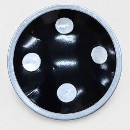 Close-up of Chalu Dhaal black surface and silver-tone decorations