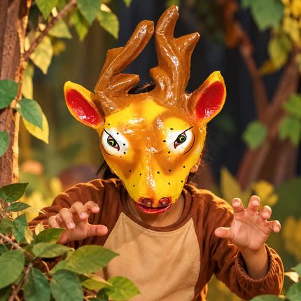Deer Mask styled with brown clothing in a woodland-themed setting