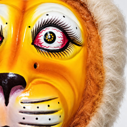 Close-up of painted eye details and fuzzy trim on Fibre Tiger Mask