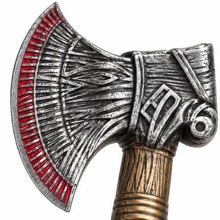 Close-up of patterned silver-tone head and red accent border