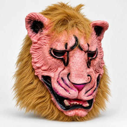 Angled view of pink textured monster mask and shaggy golden-brown mane