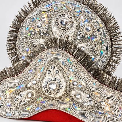 Close-up of Silver Mukut ornamental trim and reflective accents