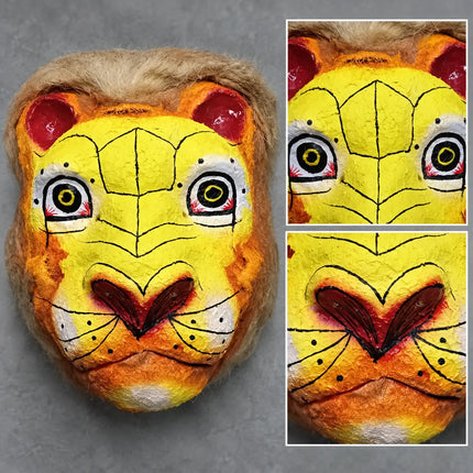 Close-up of yellow mask painted eyes, nose and muzzle