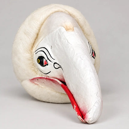 Three-quarter view of White Jatayu Mask with red beak accents