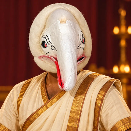 Performer wearing White Jatayu Mask with stage costume