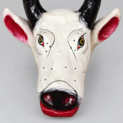 Close-up of Nandi Mask painted face and black nose