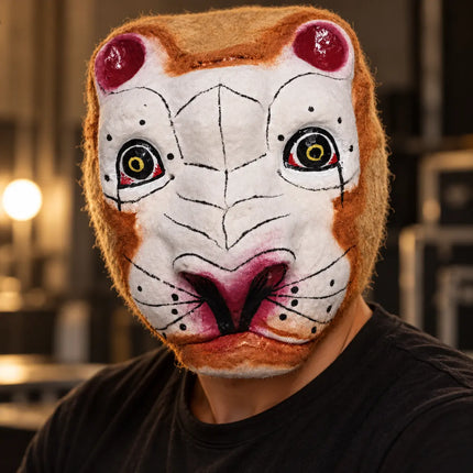 White Towel Tiger Mask worn with black clothing for costume styling